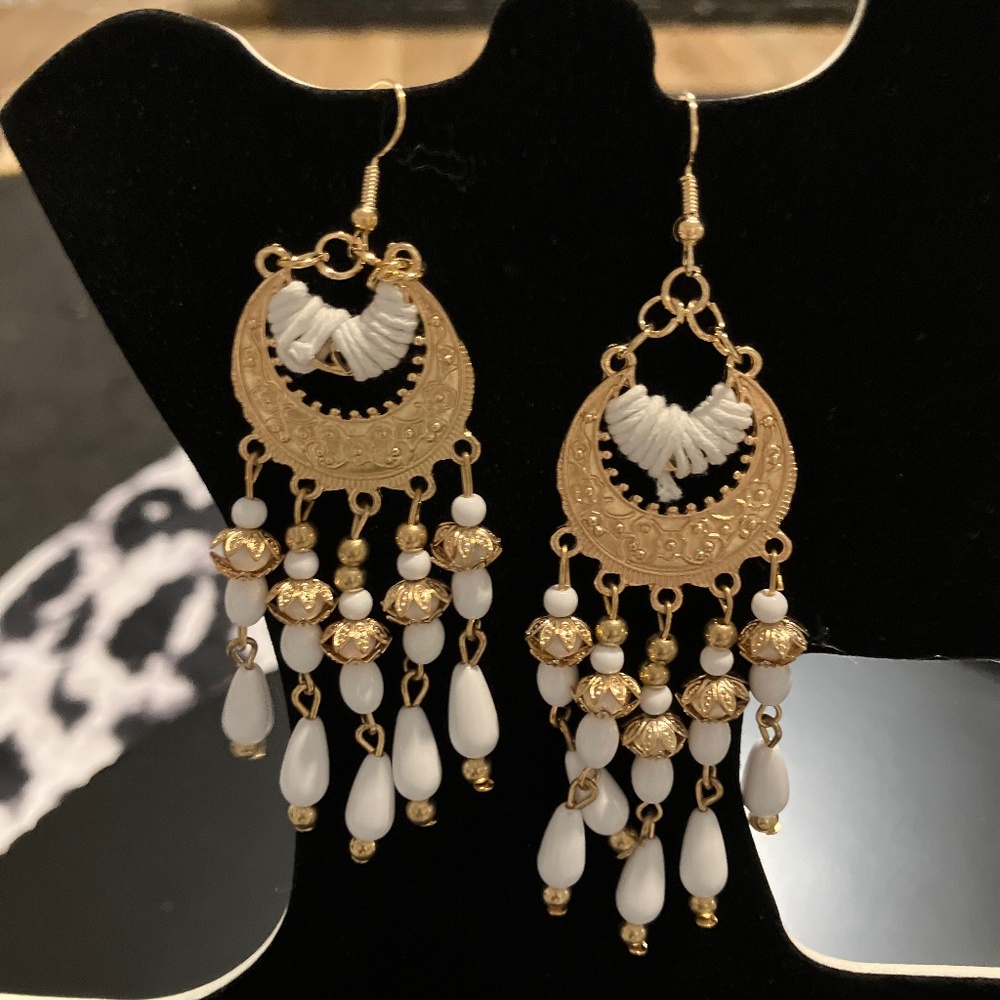 White and gold earring